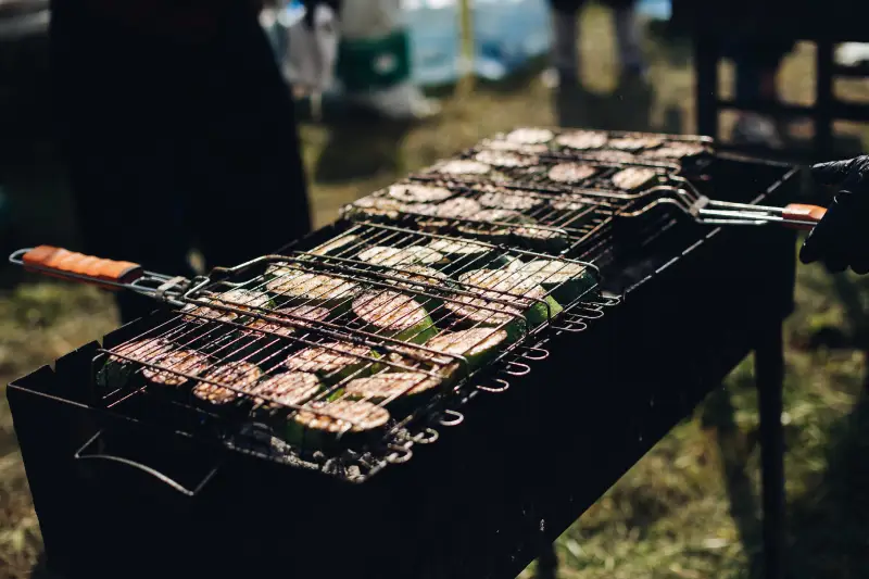 Catering, BBQ Style Cabbage on grill.Close-up of raw sliced squash being grilled on outdoors grill equipment.